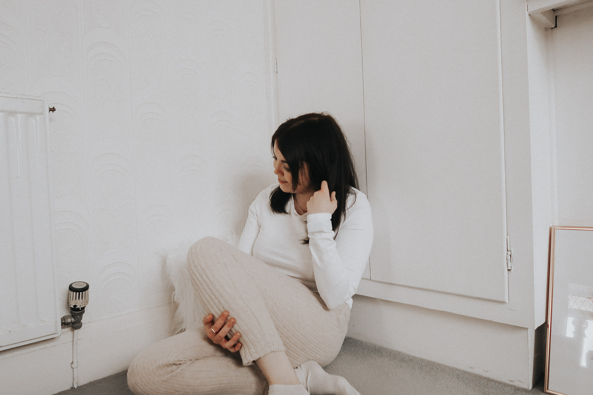 A woman sat on the floor.