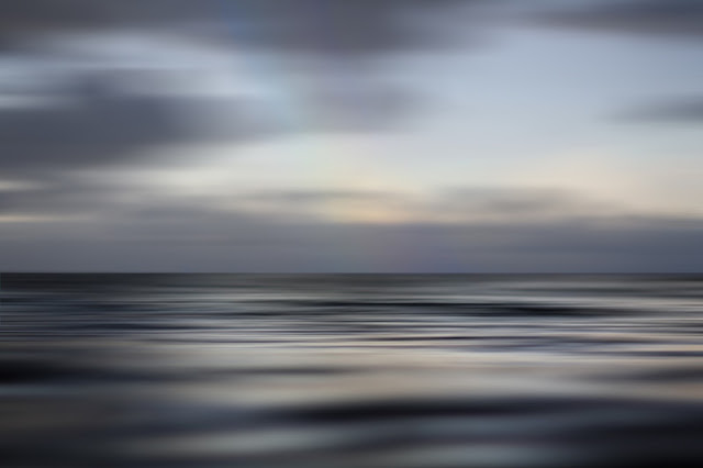 gray clouds and body of water