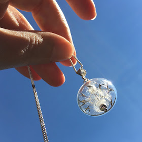 Lampwork glass bead and sterling silver necklace filled with dandelion clock seeds