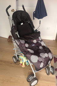 a babies buggy with footmuff and parasol