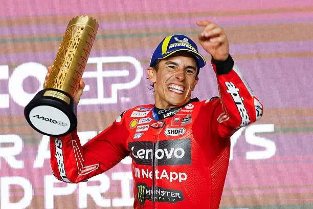Ducati Lenovo rider Marc Marquez of Spain celebrates with the trophy on the podium after winning the Qatar MotoGP Grand Prix at Lusail International Circuit in Lusail, north of Doha, on April 13, 2025. Photo by Karim Jaafar/AFP