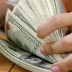Dólar tem leve alta e fecha em R$ 5,18, após dia volátil