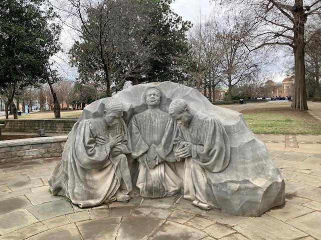 a statue of kneeling clergy