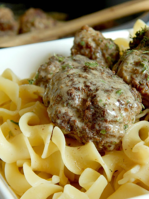 Classic Swedish Meatballs...this fun, family-friendly dinner comes together is just over 30 minutes!  Tender, flavor-filled meatballs in a homemade cream gravy, served over egg noodles.  Comfort food at its finest! (sweetandsavoryfood.com)