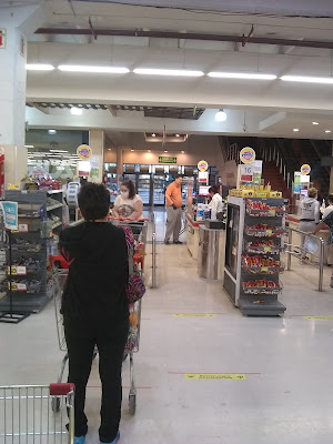 Social distancing restrictions at the register at Hiper Libertad supermarket in Cordoba, Argentina