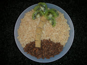 Add kiwi slices to form the palm fronds.