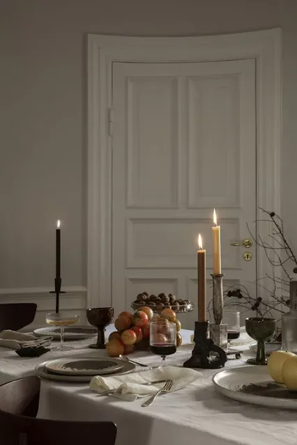 Candle holders enhance the style of the Christmas table