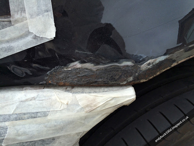 First stage of sanding on a BMW E46 Saloon Sapphire Black Rusted Rear Wheel Arch