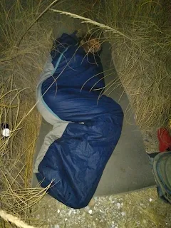 My slleping bag on my isolation mat in high dry grass.