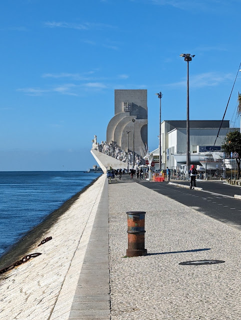 A seaside monument to Portugese explorers with sculptures of many prominent people.
