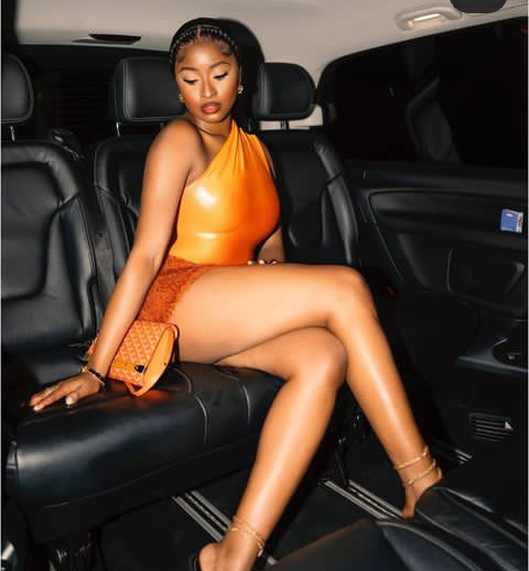 Nigerian ex-beauty queen, Kim Opara, shows off long legs in a mini skirt caused stir online