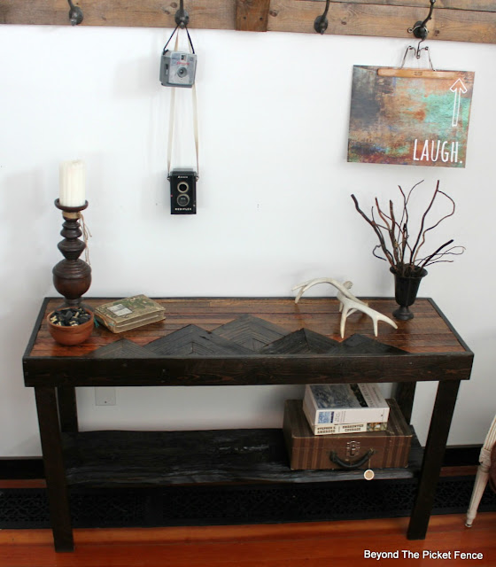 Table with a mountain design made from reclaimed wood