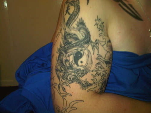 dragon tribal arm tattoo