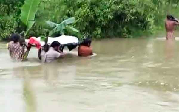 News,National,India,Bhuvaneswar,Funeral,Local-News,Allegation, No bridge, Odisha villagers carry kin's corpse on shoulders through chest-deep water for cremation