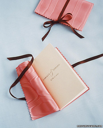 Wrap your programs in fabric that matches the colors of the wedding