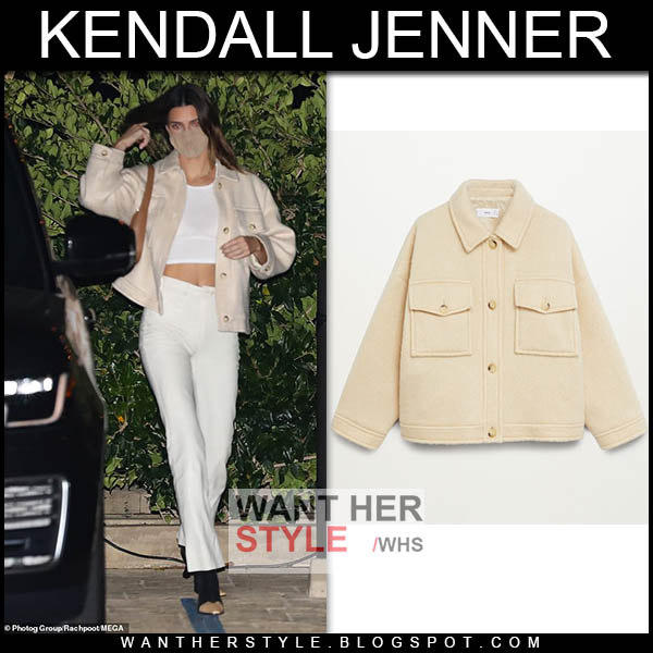Kendall Jenner in beige jacket, crop top and white pants