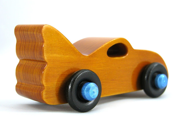 Handmade Wood Toy Car based on the Bat Car in the Play Pal Series, Amber Body, Metallic Blue Hubs, Black Wheels