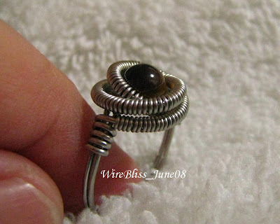 Coiled wire ring with Tiger's Eyes (6mm) focal.