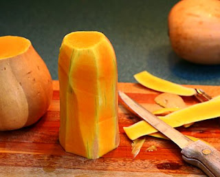 Slice the skin off the neck (How to Safely Cut a Butternut Squash into Pretty Little Cubes, Step by Step ♥ AVeggieVenture.com)