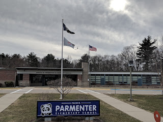 Parmenter school flags in the wind