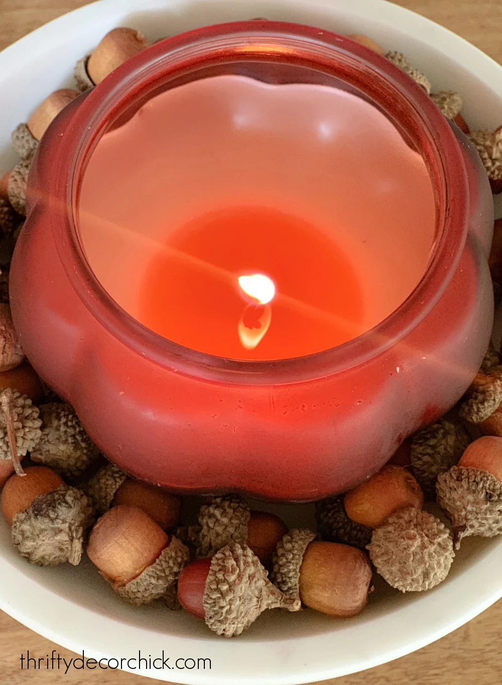 DIY pumpkin candle with acorns
