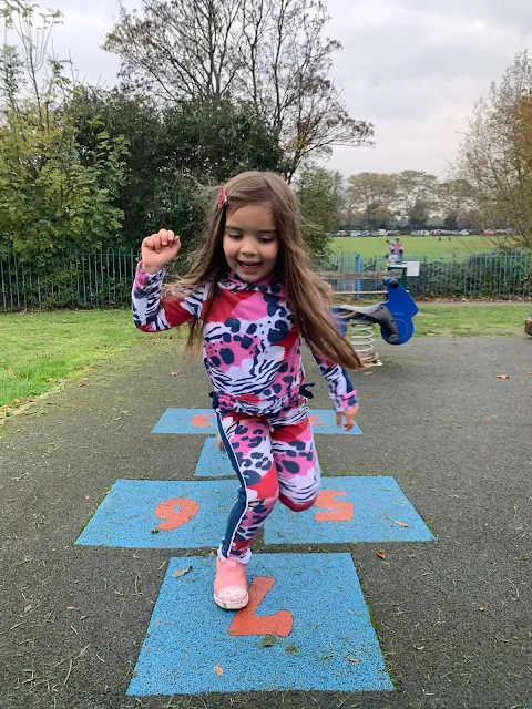 A girl on a hopscotch at Priory Park playground in Southend