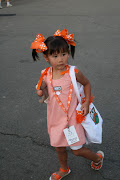 She practiced and under stood that holding up the quiet sign before a . (img )