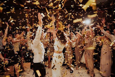 wedding ideas - wedding planning services in Philadelphia PA - reception dancing - bride and groom dancing with confetti thrown by guests - wedding ideas blog by K'Mich