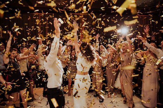 wedding ideas - wedding planning services in Philadelphia PA - reception dancing - bride and groom dancing with confetti thrown by guests - wedding ideas blog by K'Mich