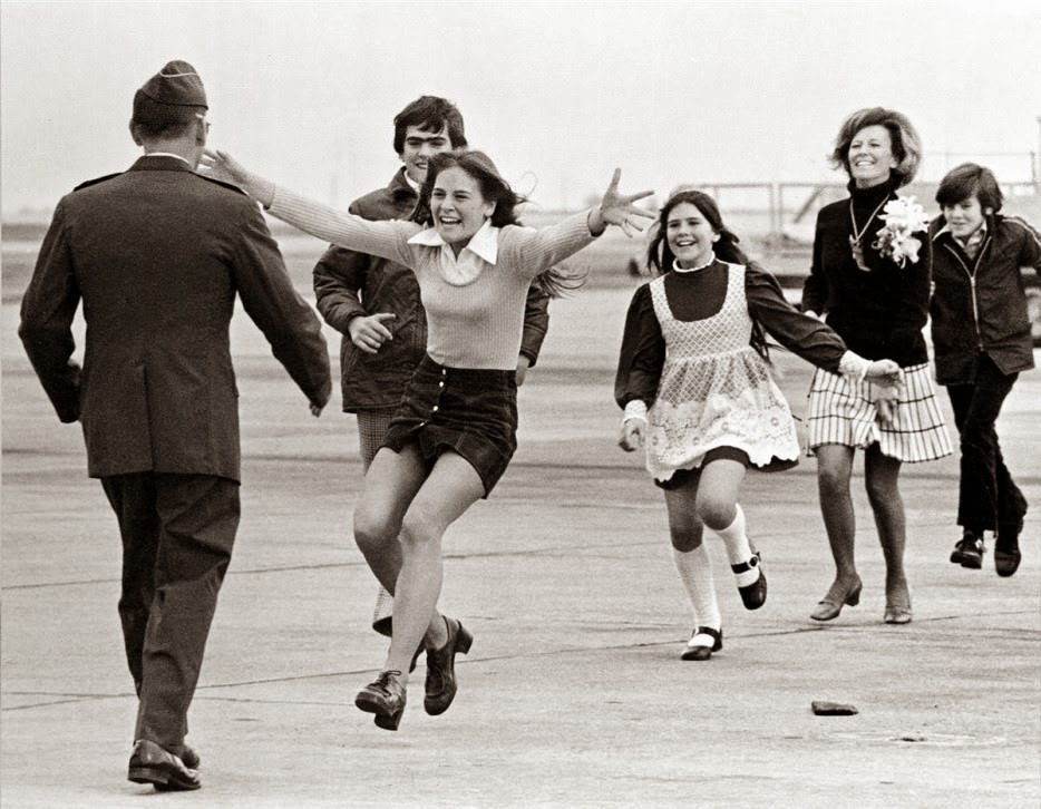 Lt. Colonel Robert L. Stirm is reunited with his family after being taken prisoner during the Vietnam war. - The 63 Most Powerful Photos Ever Taken That Perfectly Capture The Human Experience