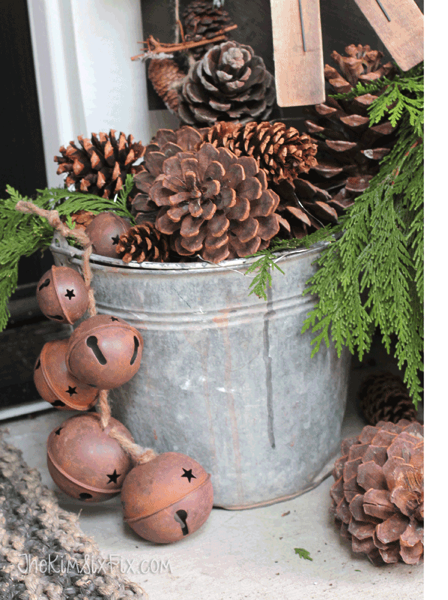 Bucket of pine cones and aged sleigh bells