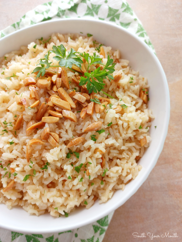 Classic Rice Almondine - A timeless side dish recipe with crunchy toasted almonds stirred into tender, savory rice made with buttery sauteed onions and garlic.