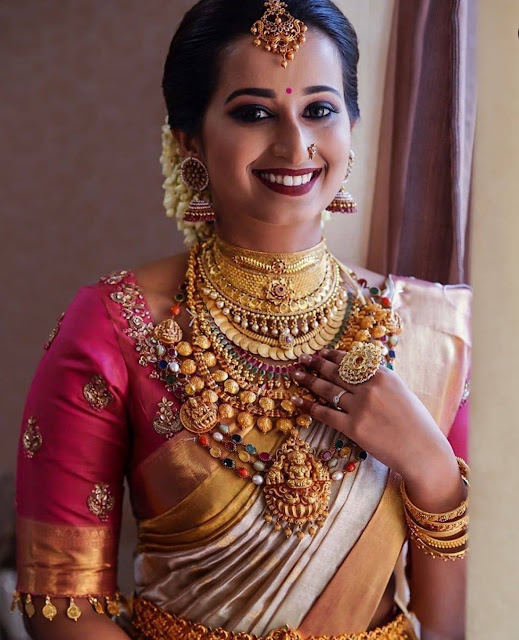 Bride in Kasu Necklace Navaratan Haram