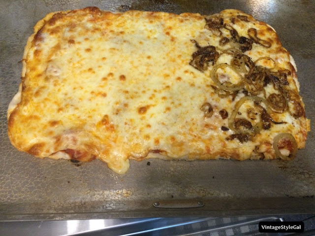 Baked gluten free pizza on baking pan ready to eat