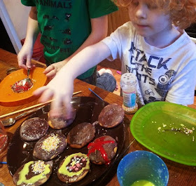 children decorating firework biscuits