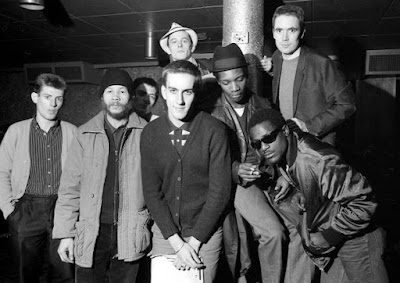 Members of The Specials, with Terry Hall in center front, pose for a newspaper photo.