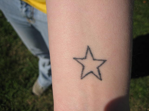 star tattoo on foot. 3 star tattoos.