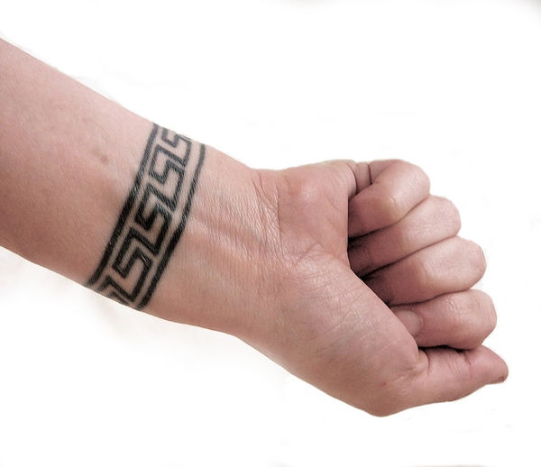 hand wrist tattoos. vincit omnia wrist tattoo.