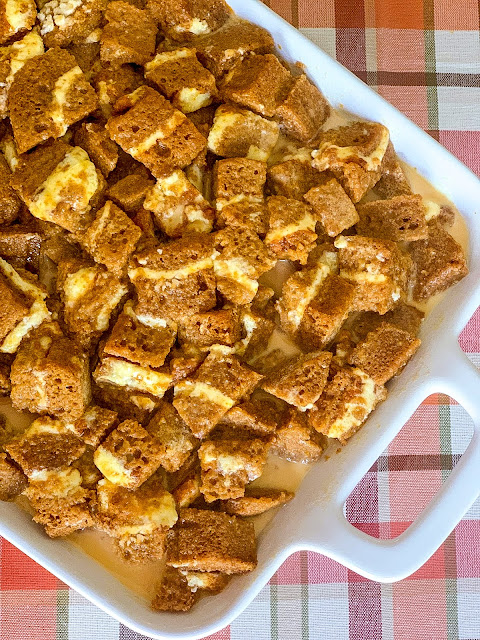 The bread pudding takes on a whole new level of deliciousness using a pumpkin roll cake cut up into cubes, and to add more richness, a pumpkin puree custard is poured over all the cubes.  And served with the Ultimate Custard Sauce, made with a secret ingredient.