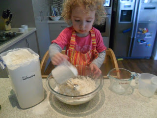 Measuring flour for the Strawberry Muffins