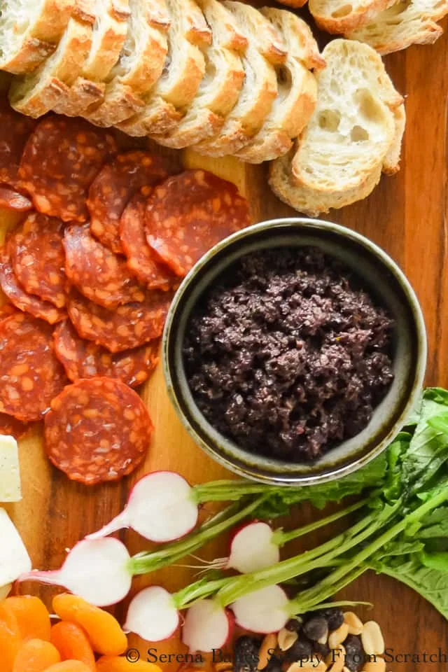 Easy Black Olive Tapenade recipe is a delicious appetizer or sandwich spread. A favorite on Charcuterie boards for crackers to go with cheese from Serena Bakes Simply From Scratch.
