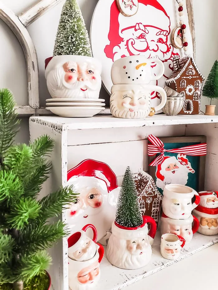 chippy white box filled with vintage Santa mugs