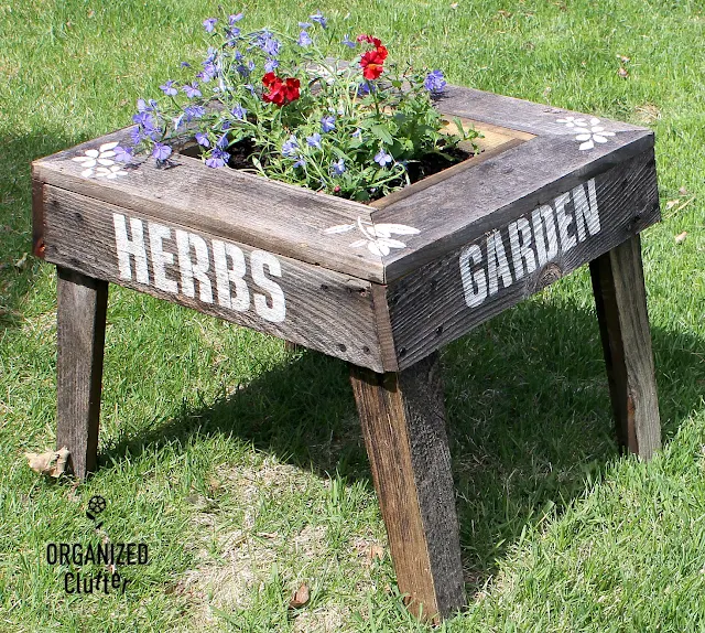 Garage Sale Weathered Wood Junk Garden Planter #oldsignstencils #gardenjunk #junkgarden #containergarden #nemesia #lobelia