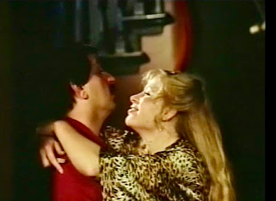 Johnathon and Carol happily embrace in carnage