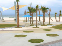 public beach Gulf Shores with picnic tables and shade pavilions