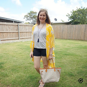 awayfromtheblue Instagram | Jeanswest Eliza summer poncho in yellow floral  denim shorts tee beach picnic outfit