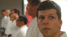 jesse eisenberg in a karate dojo