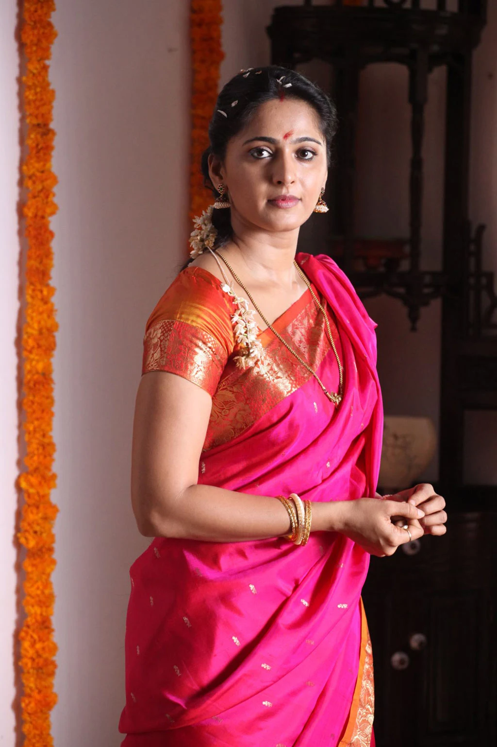Indian Girl Anushka Shetty Long Hair Stills In Red Traditional Saree