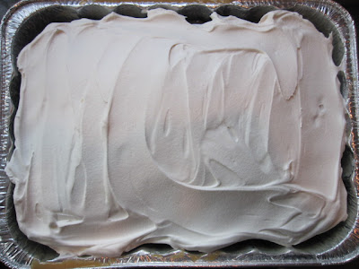 After the cake is chilled completely spread cool whip over the top