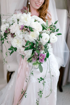 bride with overflowing wedding bouquet